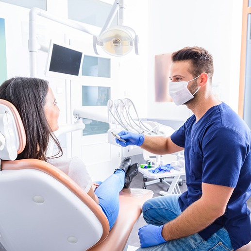 A dentist discussing treatment with his patient