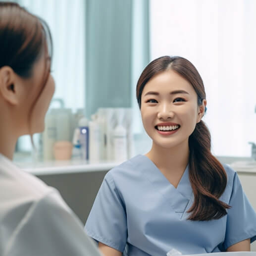 Smiling woman in blue scrubs