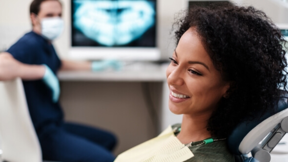 Smiling woman in dental chair