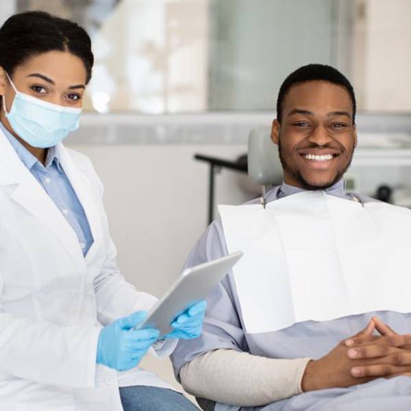 Happy patient and dental team member