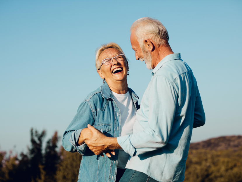 Senior couple smiling and dancing