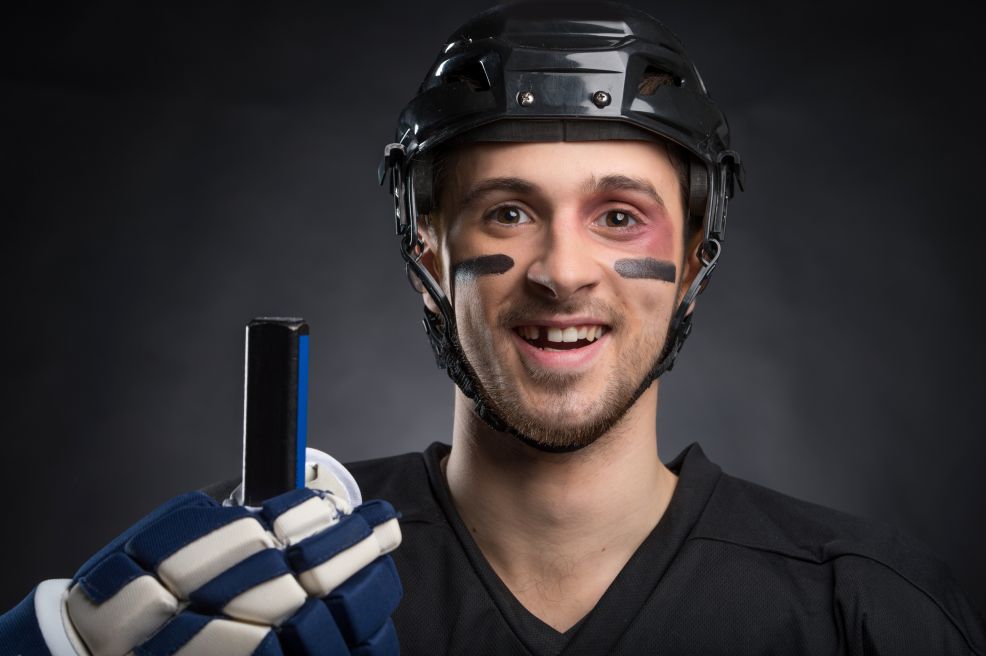 A hockey player with a missing tooth